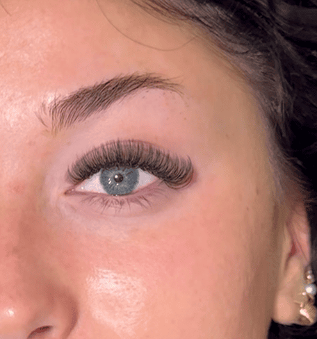 Beautiful textured hybrid lash extensions full set with a natural yet defined look, expertly applied at our studio in Riverton, Utah.
